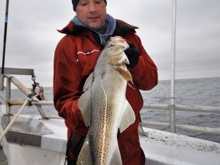 A guide to fishing for cod at Block Island with highlights about where to bottom fish, size regulations, rigs, bait, and more.