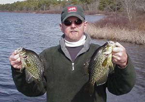 The author’s friend Pete displays his fat early-season crappies.