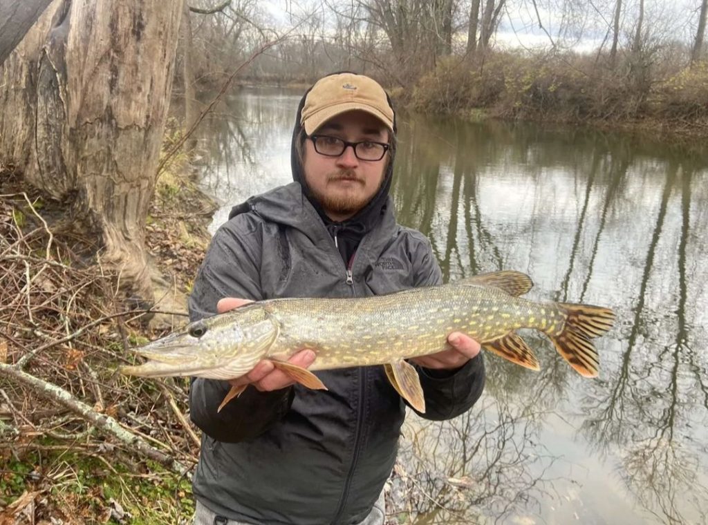 Josh from The Fishing Hole with river pike