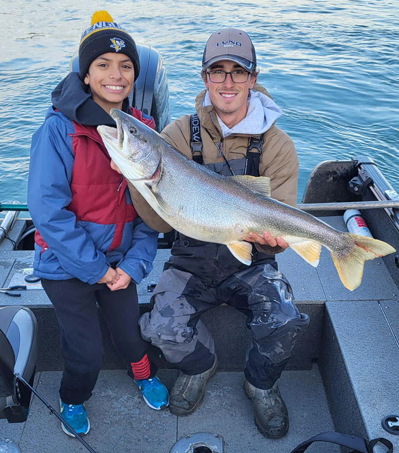 Milan Singh and Capt. Connor Cinelli with lake trout