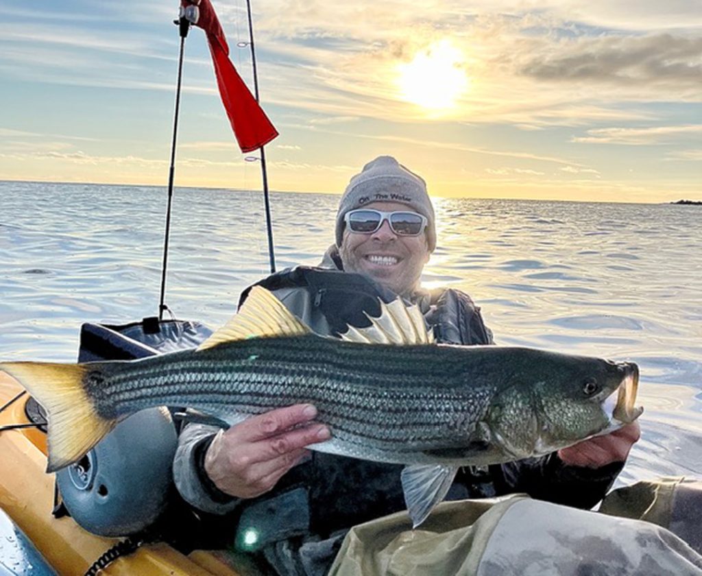 Ron with kayak caught striper